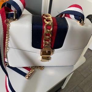 White brand new like “Gucci” purse